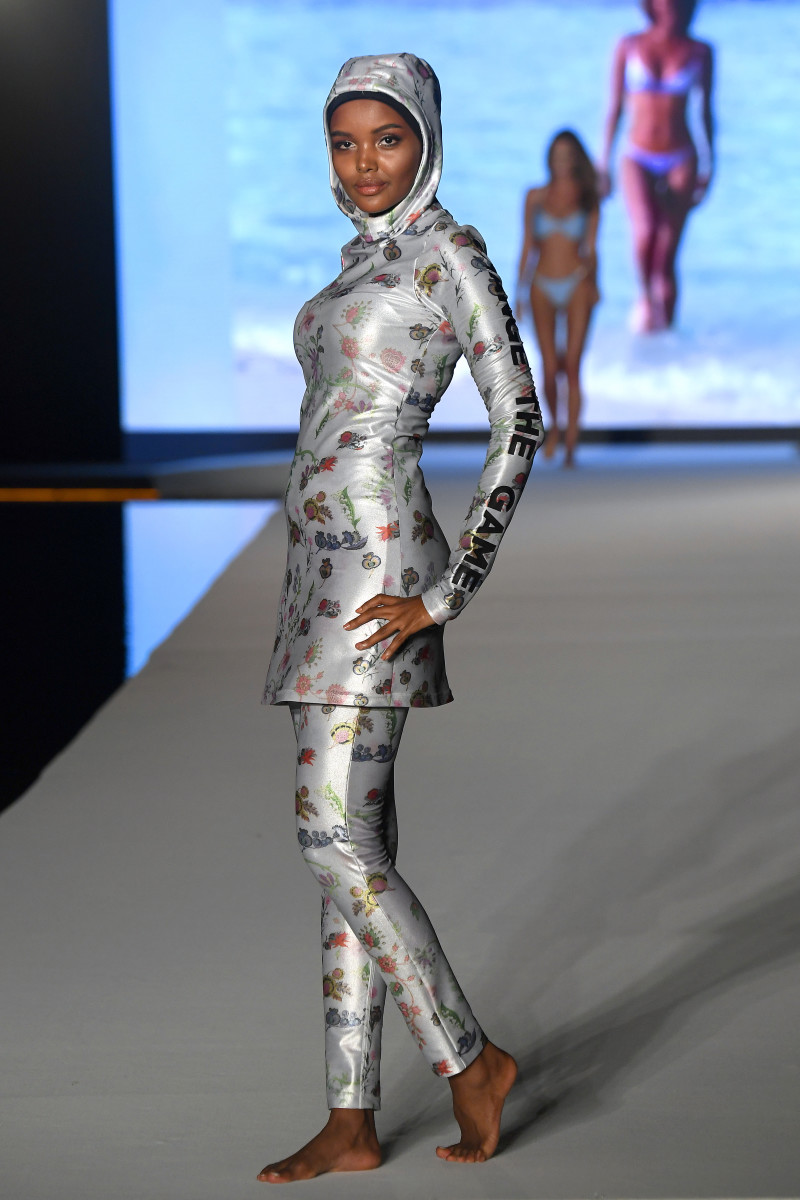 Halima Aden walks the runway during the 2019 Sports Illustrated Swimsuit Runway Show During Miami Swim Week At W South Beach - Runway at WET poolside lounge at W South Beach on July 14, 2019 in Miami Beach, Florida